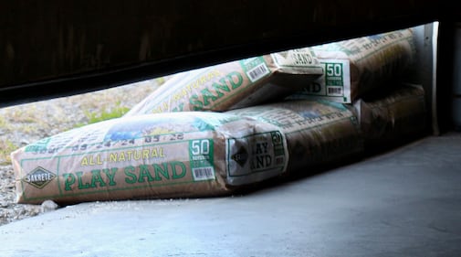 Sandbags underneath a garage door.